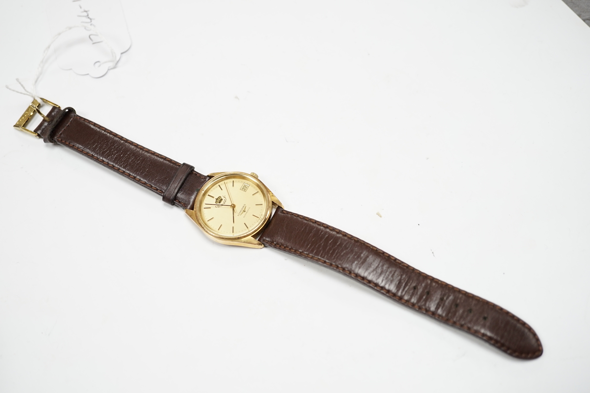 A gentleman's steel and gold plated Longines Automatic wrist watch, the dial with King Hussein of Jordan crown, on associated leather strap, with Longines box.